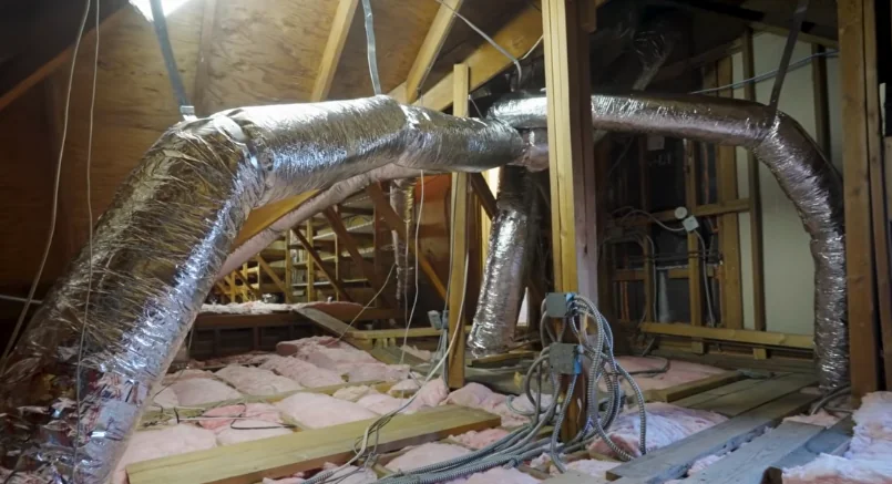 Attic ductwork and insulation being inspected for rodent activity
