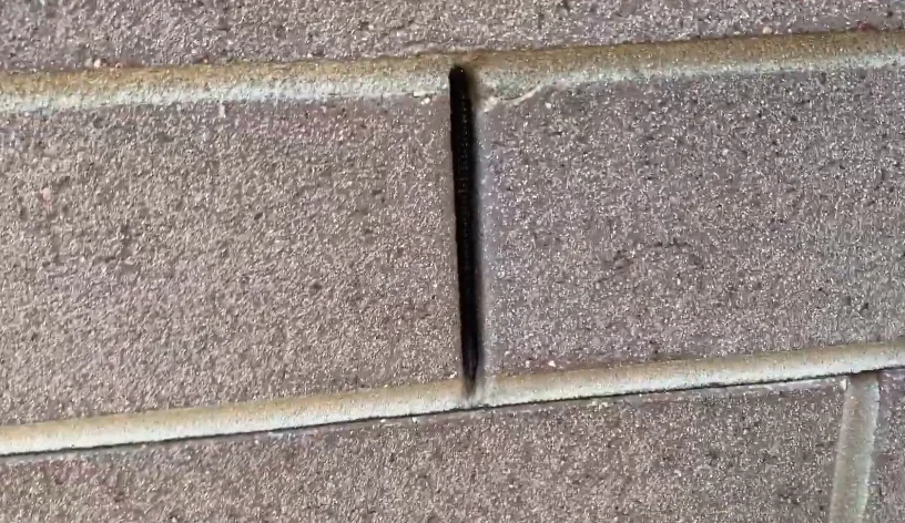 Open weep hole in a brick wall that mice can use to get inside