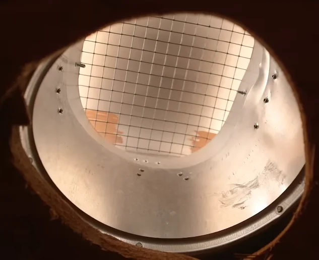 Roof vent seen from inside the attic with a heavy wire mesh screen installed
