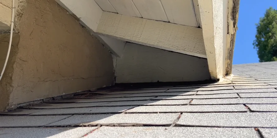 Gap under a roofline where the fascia meets the roof, used by roof rats to enter an attic